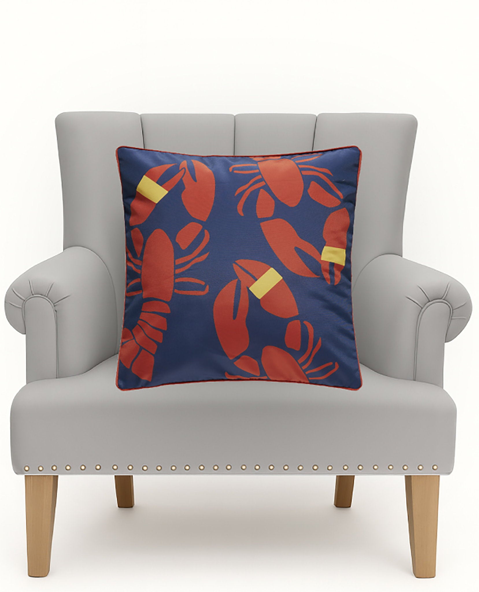 Lobster Bake Printed Throw Pillow on an armchair, showing the throw pillow at room scale, 20x20 inch