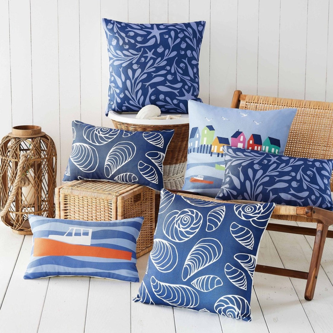 Lobster Cove House Printed Throw Pillow shown alongside other designs in the same collection, 20x20 inch