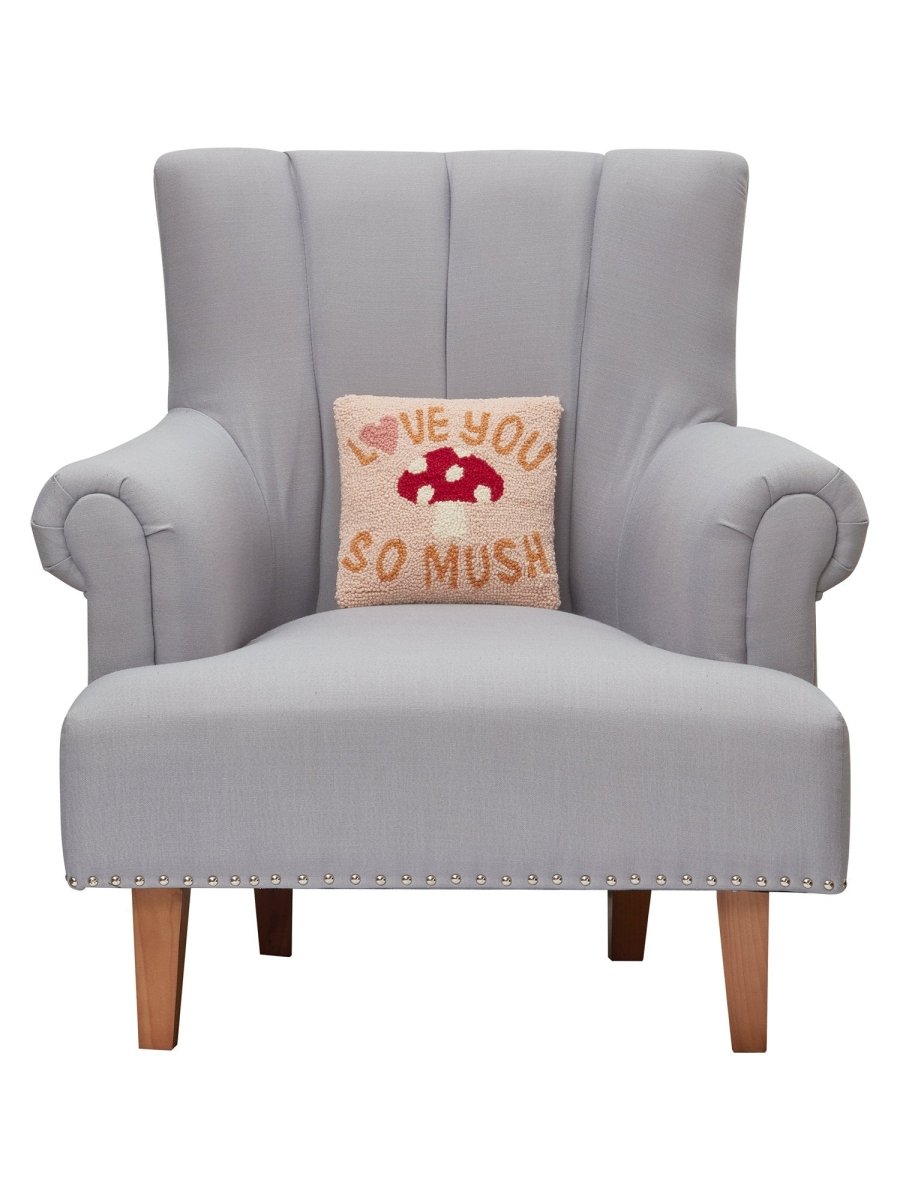 Love You So Much Hooked Wool Throw Pillow on an armchair, showing the throw pillow at room scale, 10x10 inch