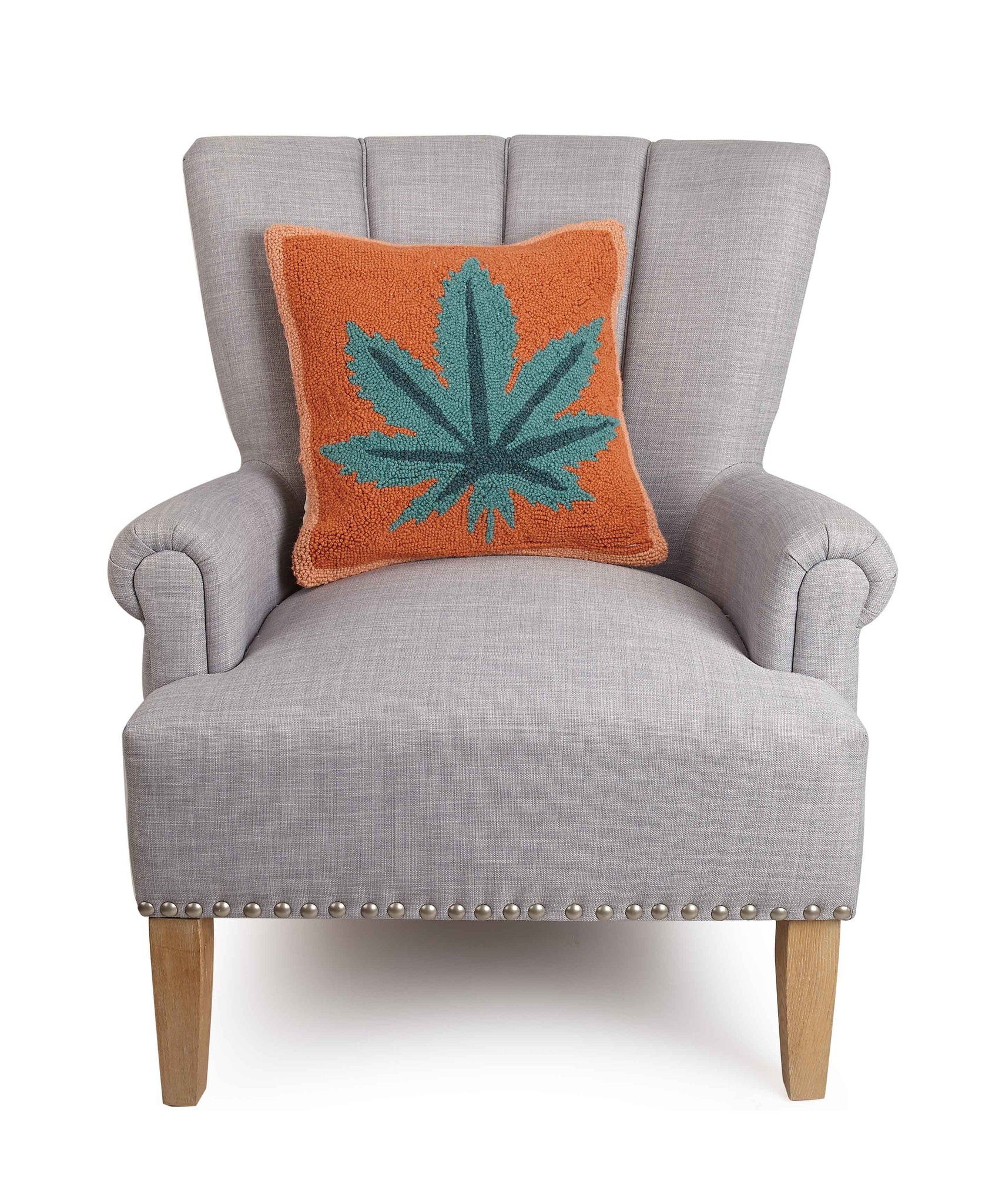 Mary Jane Hooked Wool Throw Pillow on an armchair, showing the throw pillow at room scale, 16x16 inch
