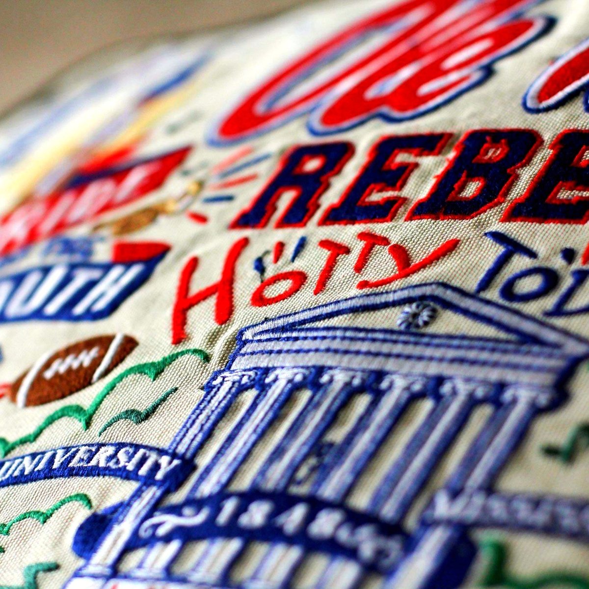 Mississippi Ole Miss Rebels Embroidered College Pillow - close-up detail of hand-embroidered needlepoint stitching