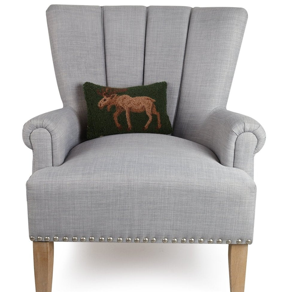 Moose Hooked Wool Throw Pillow on an armchair, showing the throw pillow at room scale, 8x12 inch