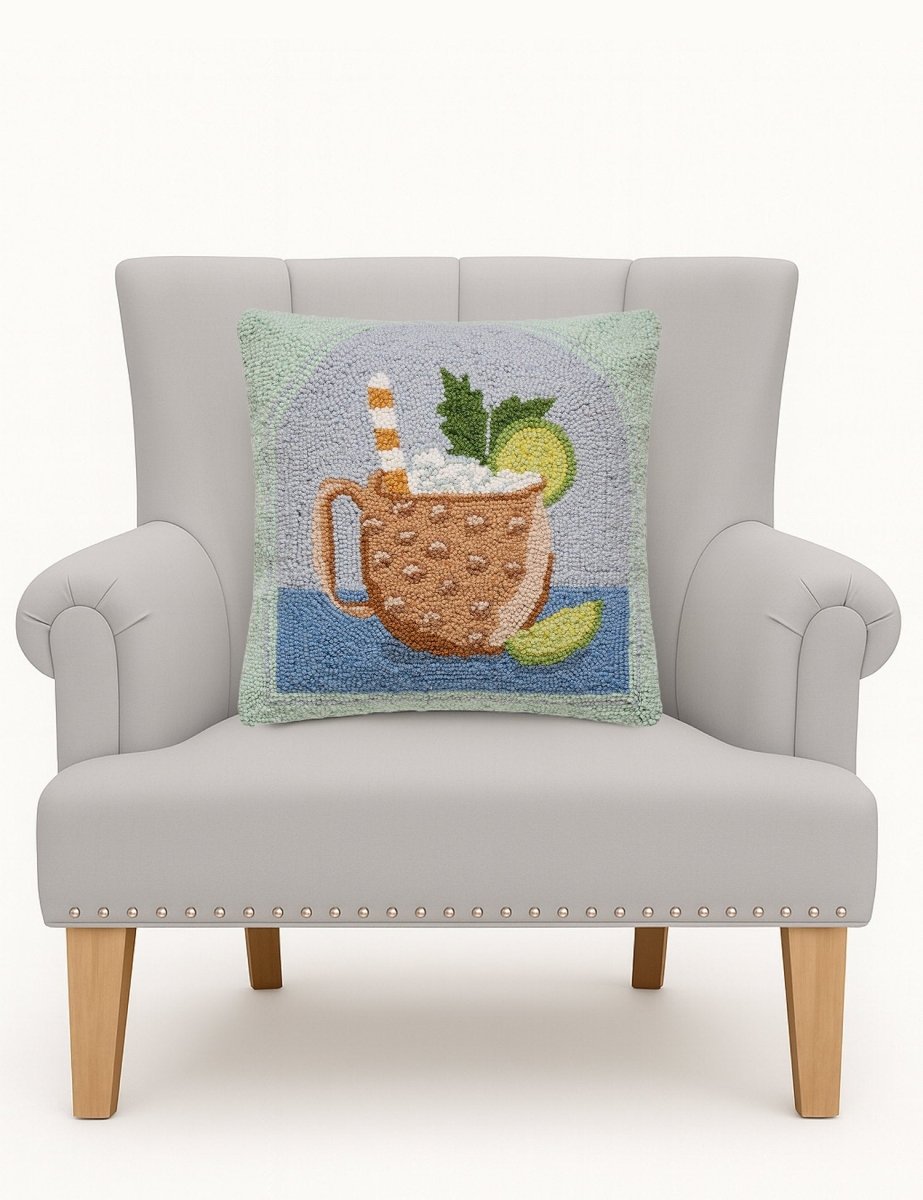 Moscow Mule Hooked Wool Throw Pillow on an armchair, showing the throw pillow at room scale, 16x16 inch