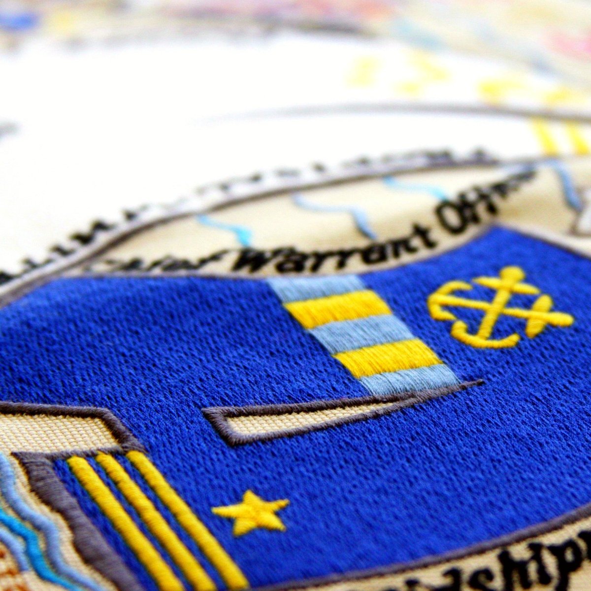 Navy Military Appreciation Embroidered Throw Pillow - close-up detail of hand-embroidered needlepoint stitching