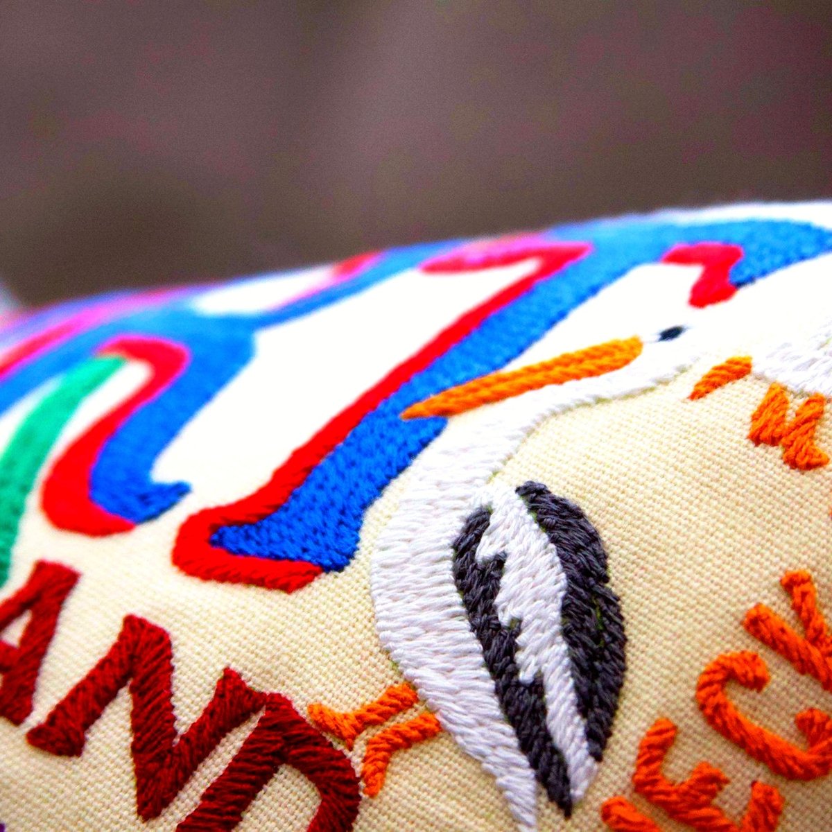 Newport, RI Seaside City Embroidered Travel Pillow - close-up detail of hand-embroidered needlepoint stitching