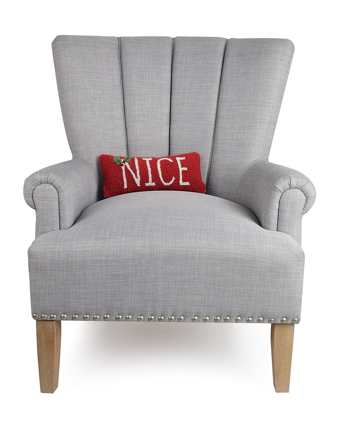 Nice Hooked Wool Christmas Throw Pillow on an armchair, showing the throw pillow at room scale, 12x5 inch