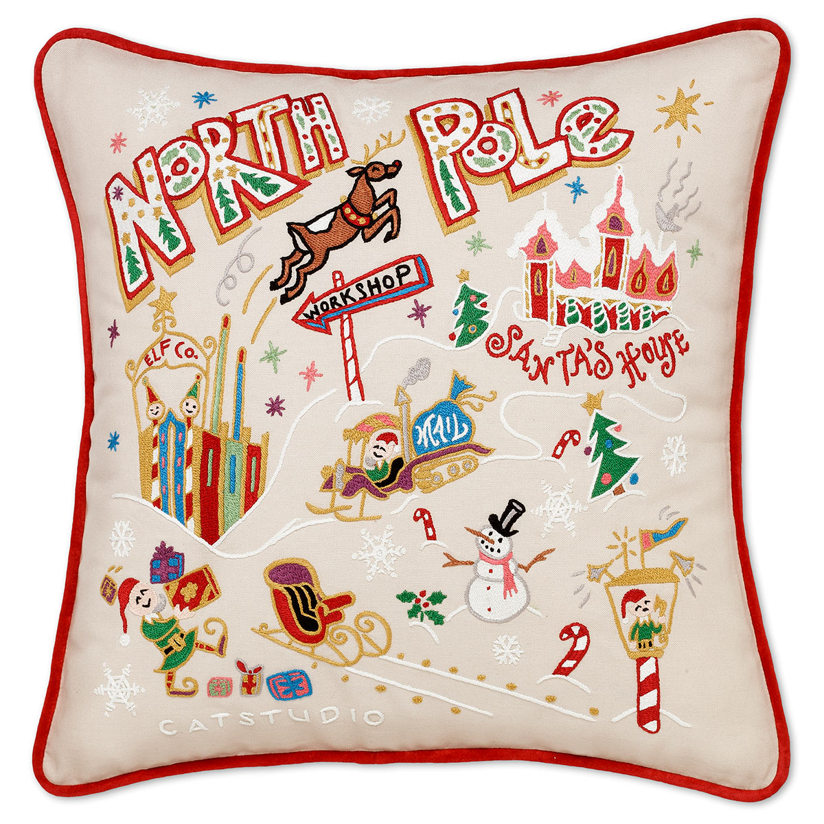 North Pole Holiday embroidered throw pillow with Santa's village design.