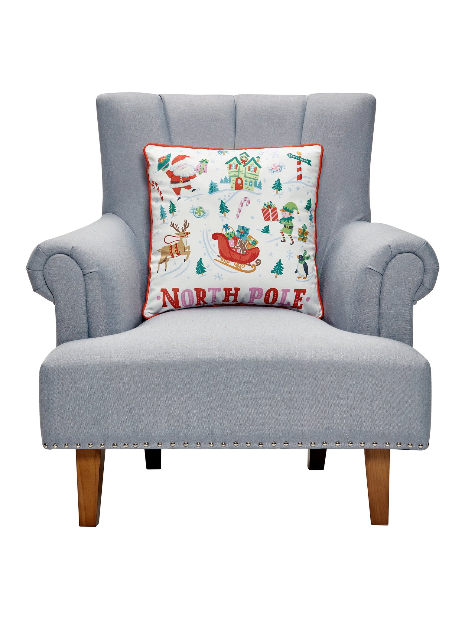 North Pole Printed Christmas Throw Pillow on an armchair, showing the throw pillow at room scale, 18x18 inch