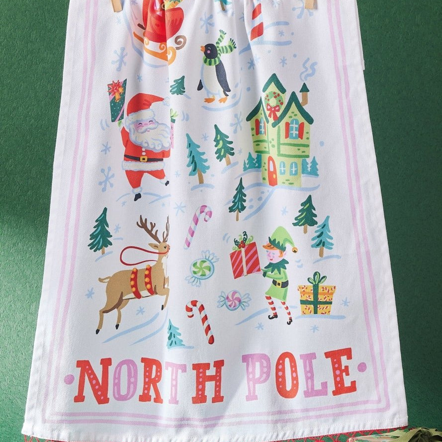 North Pole with Pom Poms Christmas Kitchen Towel styled in a room setting, 18x25 inch