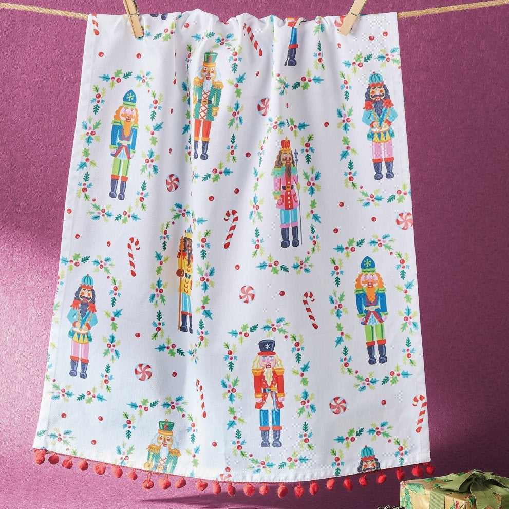 Nutcrackers with Pom Pom Christmas Kitchen Towel styled in a room setting, 18x25 inch