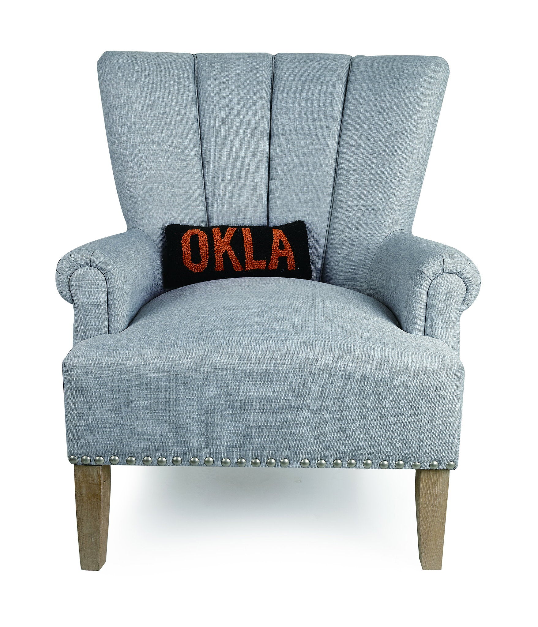Oklahoma Black/Orange Hooked Wool Throw Pillow on an armchair, showing the throw pillow at room scale, 12x5 inch