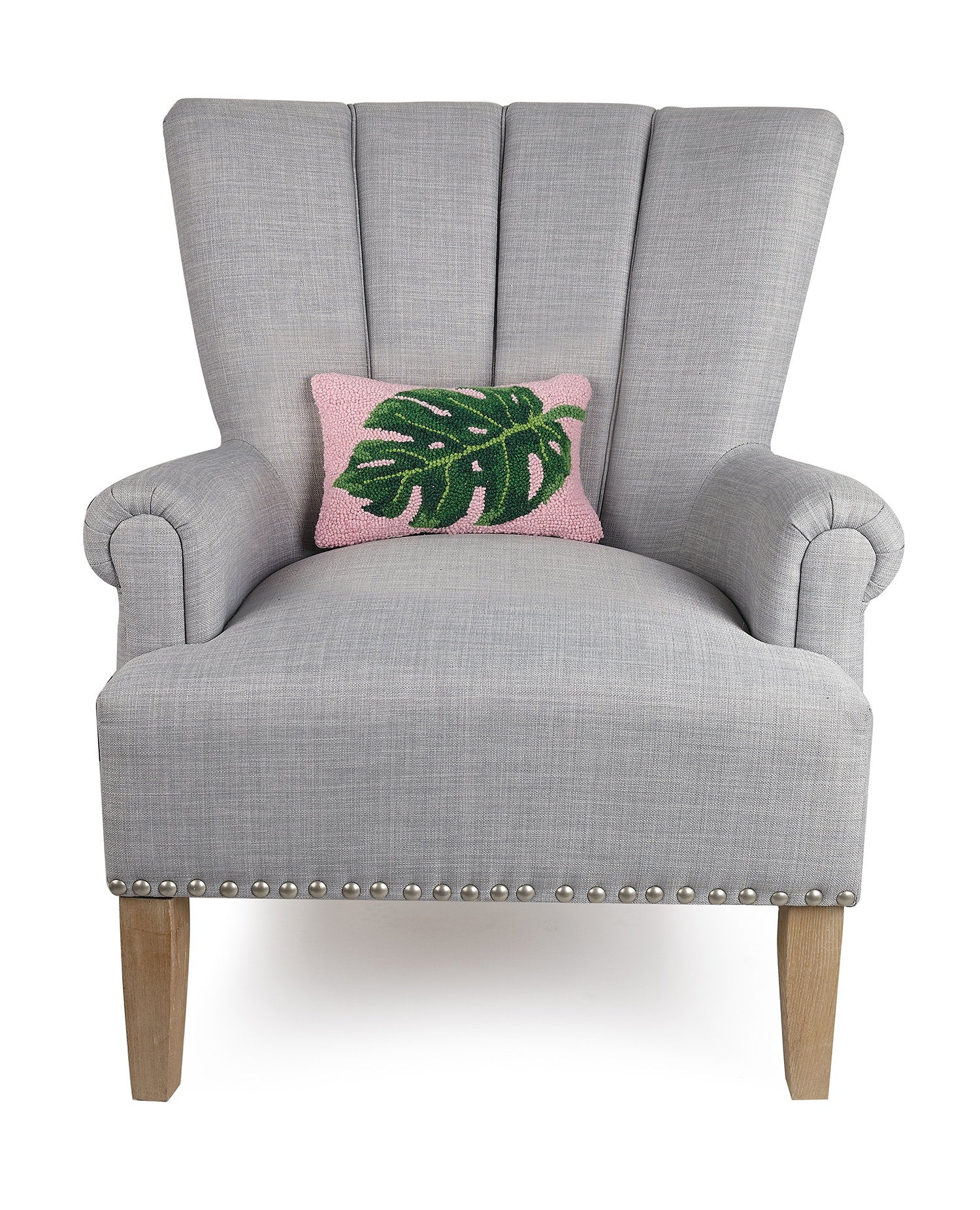 Palm Leaf Hooked Wool Throw Pillow on an armchair, showing the throw pillow at room scale, 8x12 inch