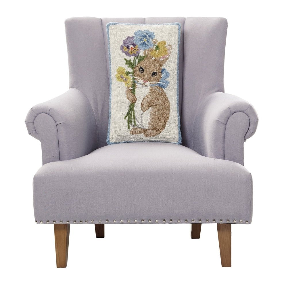 Pansy Rabbit Hooked Wool Easter Throw Pillow on an armchair, showing the throw pillow at room scale, 12x20 inch