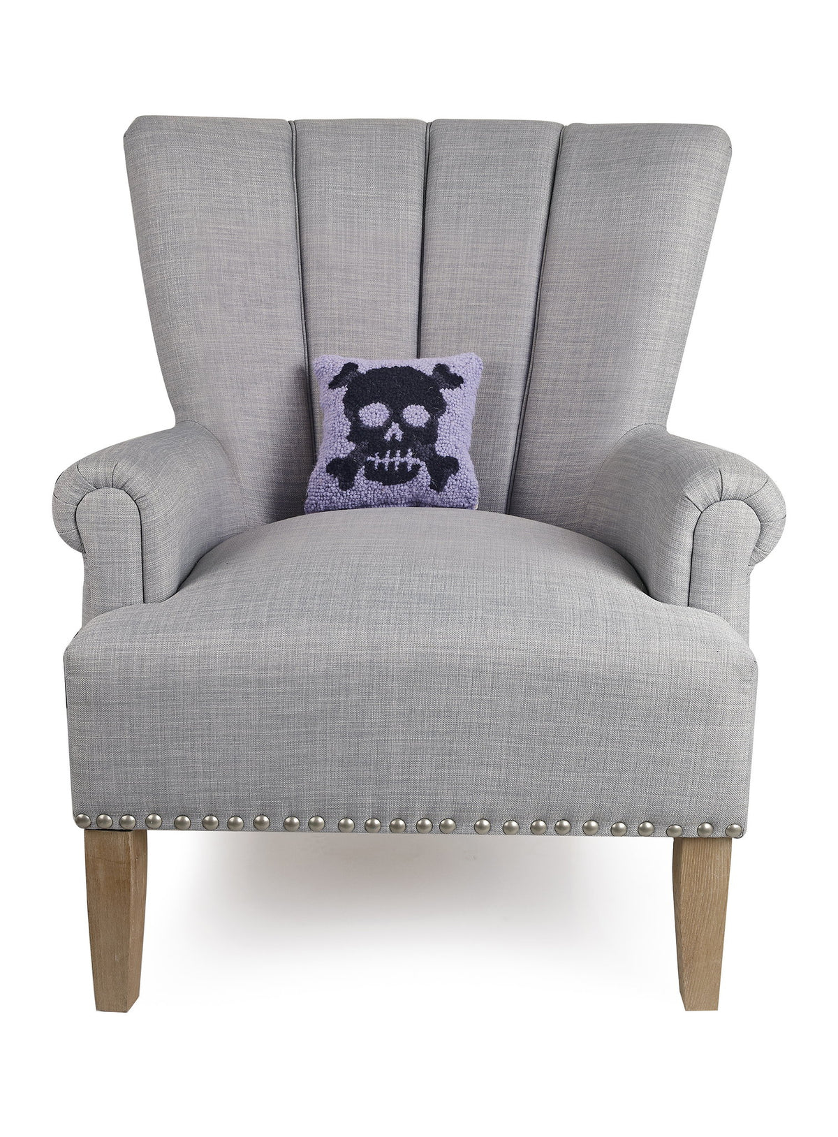 Pastel Skull Hooked Wool Halloween Throw Pillow on an armchair, showing the throw pillow at room scale, 8x8 inch