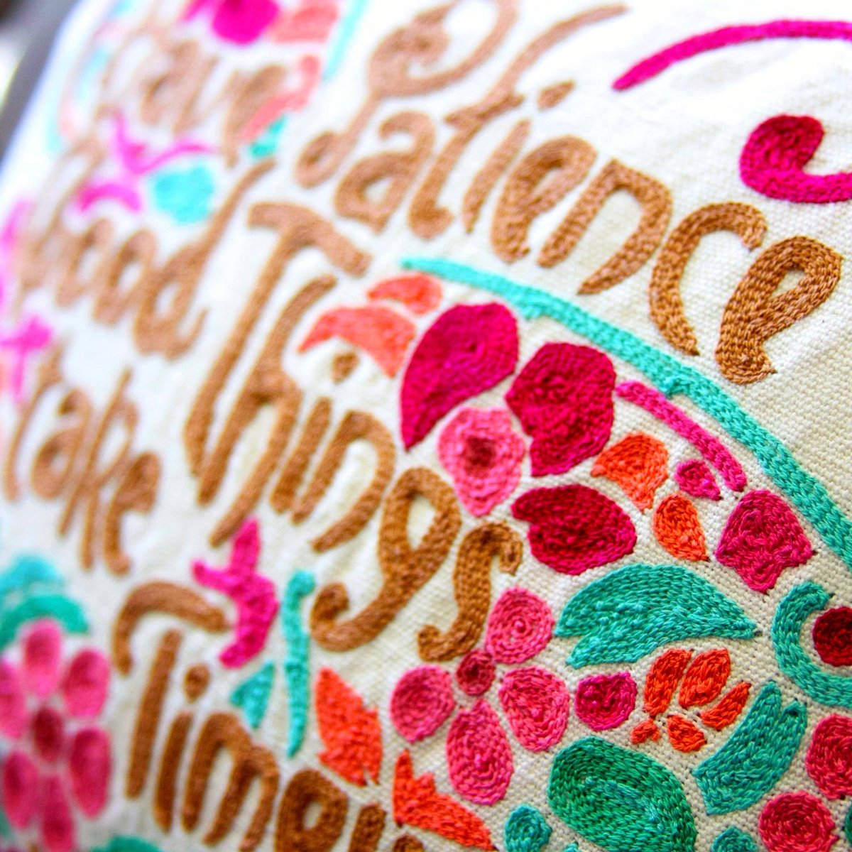 Patience Butterfly Pink Embroidered Throw Pillow - close-up detail of hand-embroidered needlepoint stitching