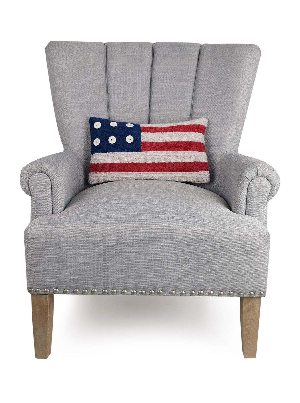 Patriotic Flag Hooked Wool Throw Pillow on an armchair, showing the throw pillow at room scale, 9x16 inch