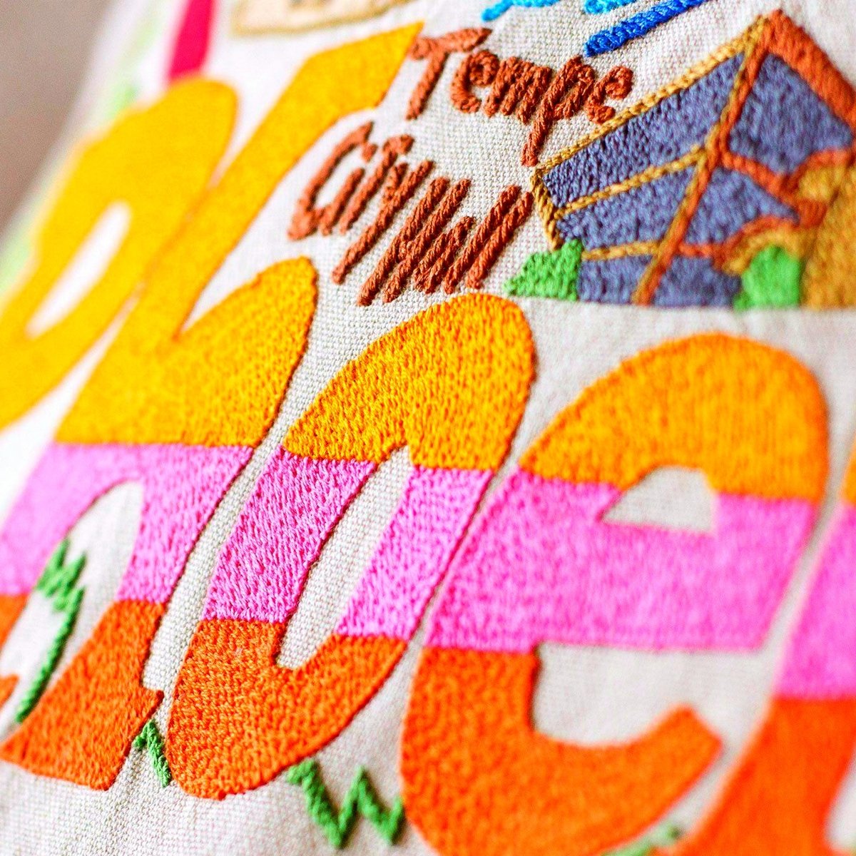 Phoenix, AZ Valley City Embroidered Travel Pillow - close-up detail of hand-embroidered needlepoint stitching