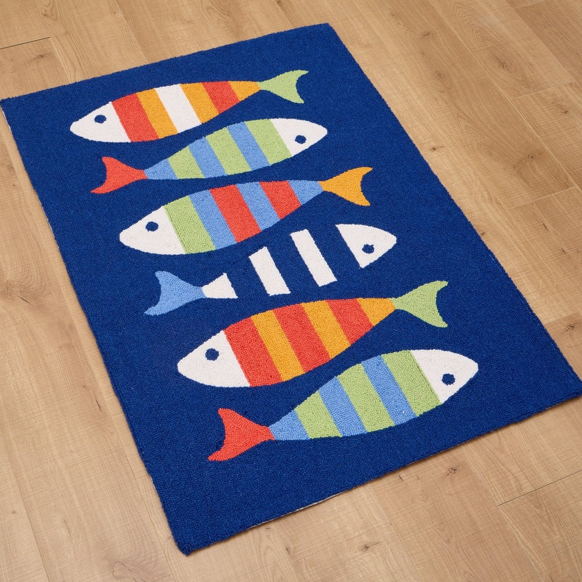 Picket Fish Hooked Wool Rug styled in a room setting, 34x47 inch