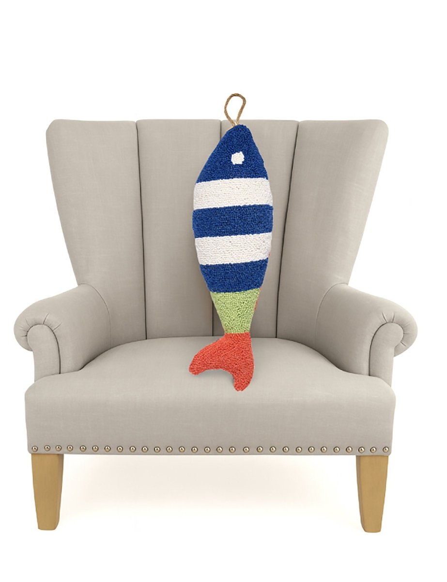 Picket Fish Shaped Hooked Wool Throw Pillow on an armchair, showing the throw pillow at room scale, 8x22 inch