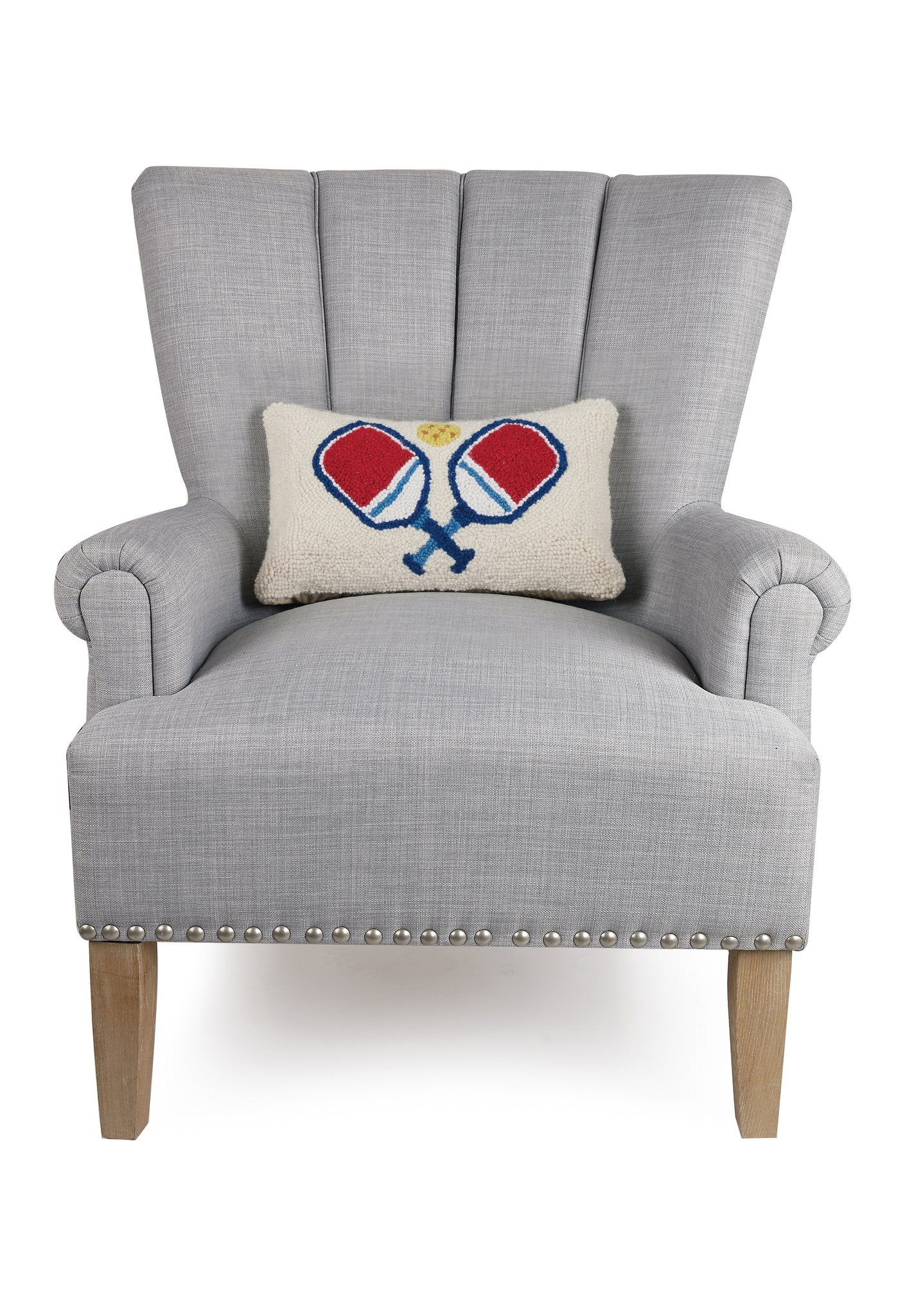 Pickleball Hooked Wool Throw Pillow on an armchair, showing the throw pillow at room scale, 9x16 inch