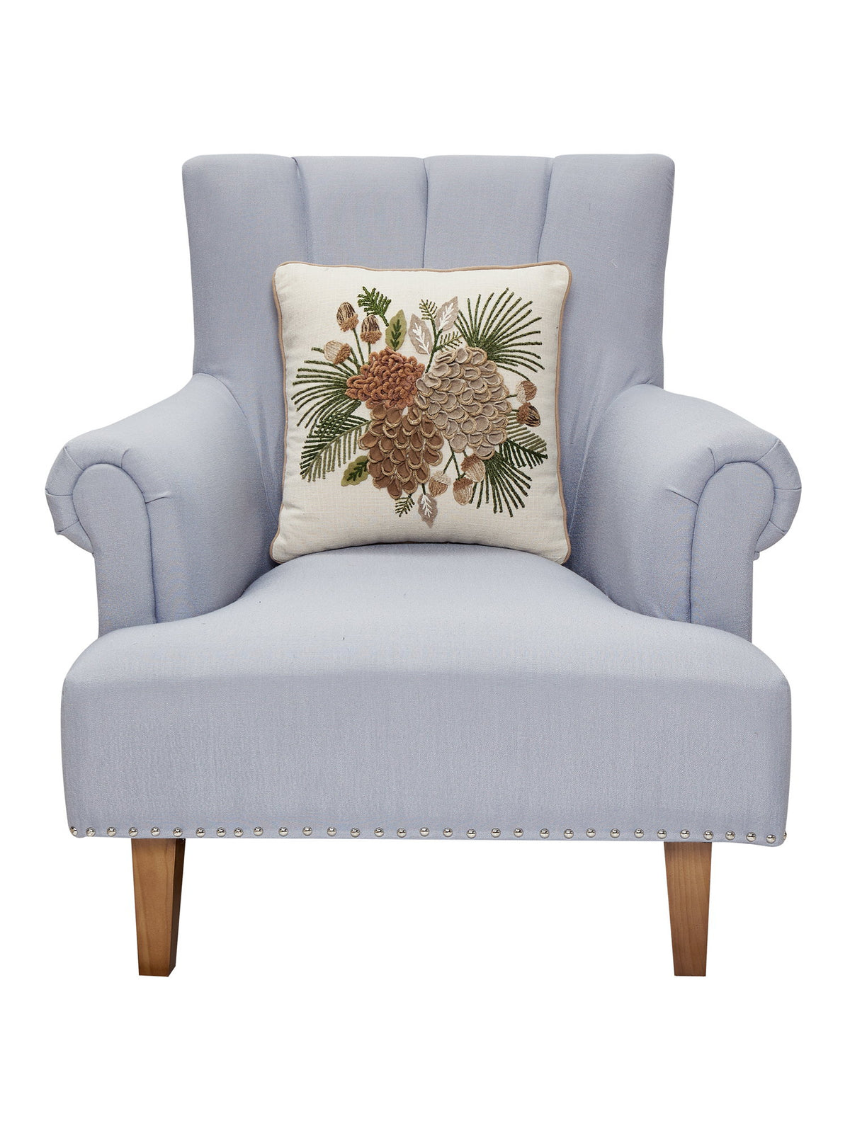 Pine Cluster Embroidered Christmas Throw Pillow on an armchair, showing the throw pillow at room scale, 16x16 inch