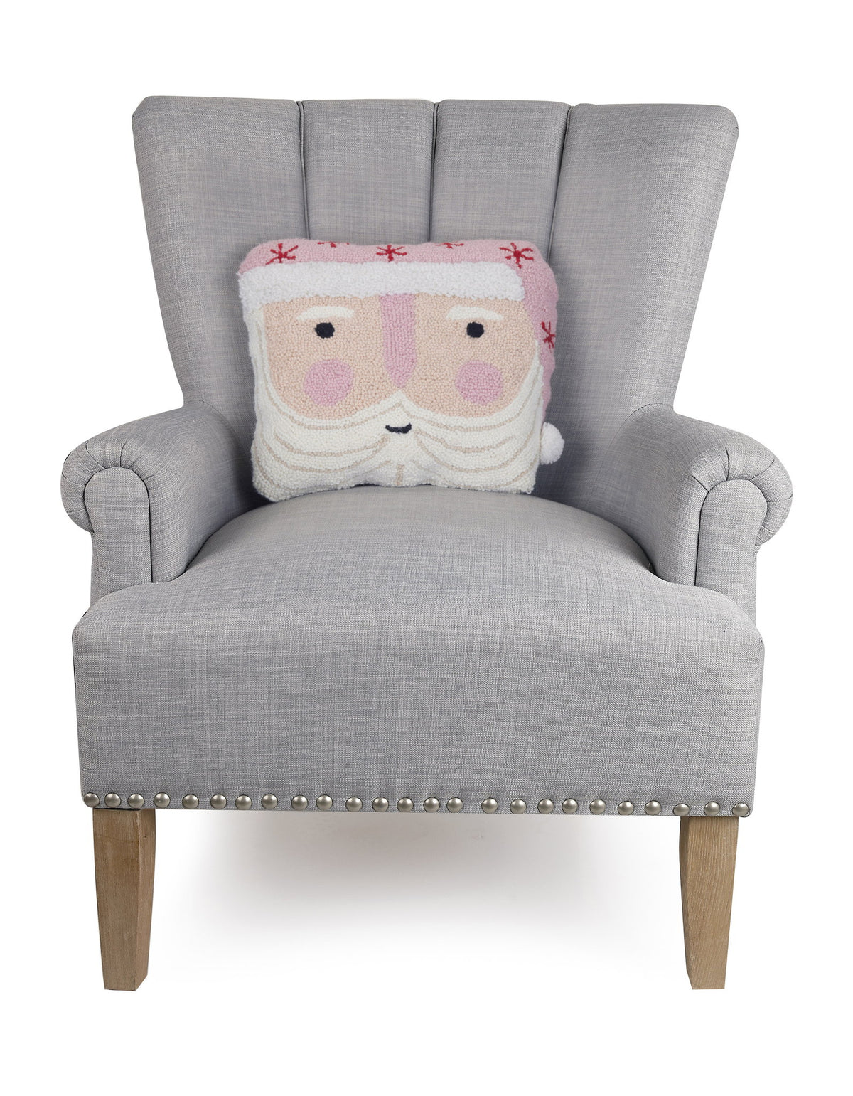 Pink Hat Santa Shaped Hooked Wool Christmas Throw Pillow on an armchair, showing the throw pillow at room scale, 14x16 inch
