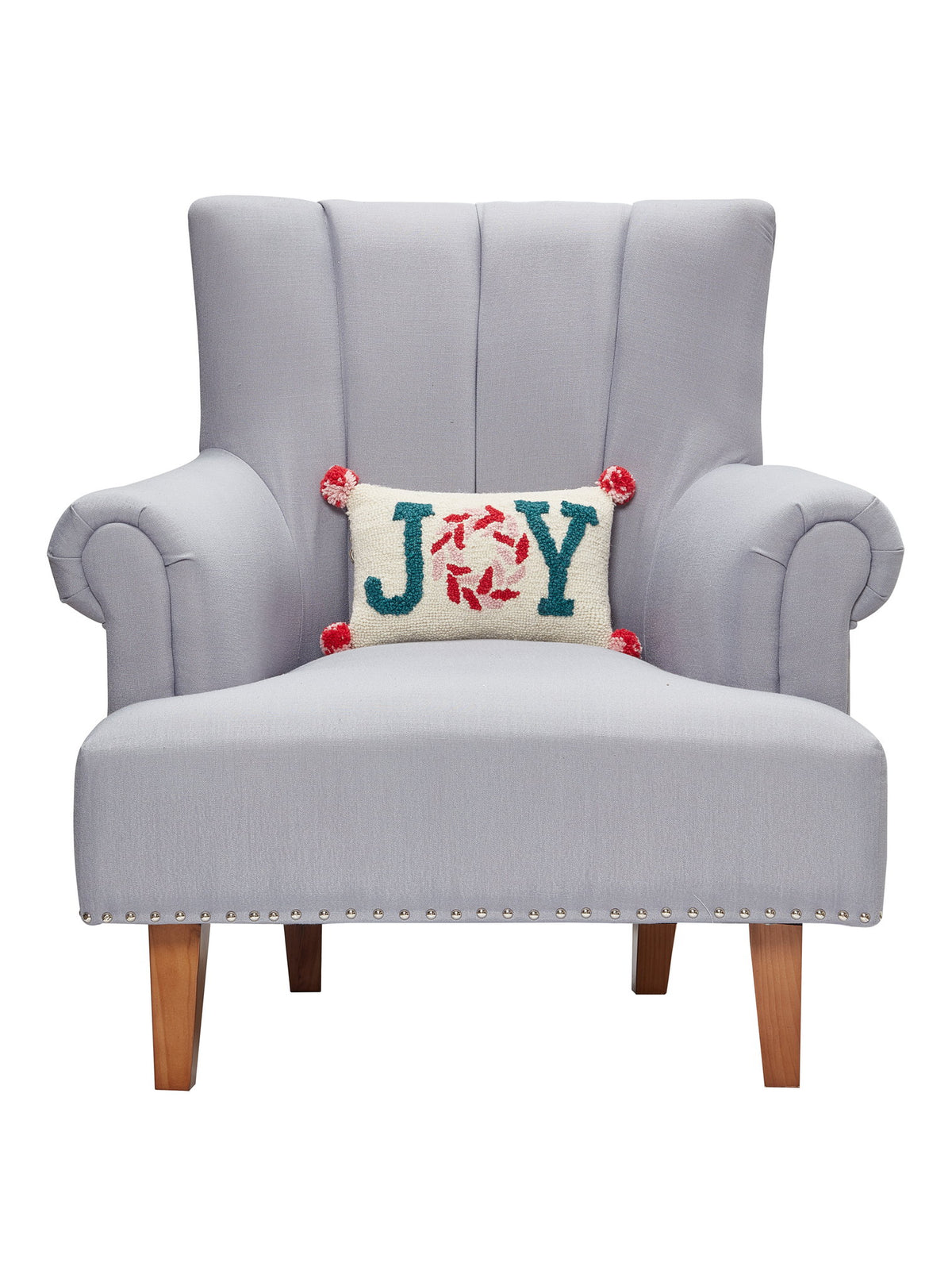 Pink Joy with Pompom Hooked Wool Christmas Throw Pillow on an armchair, showing the throw pillow at room scale, 8x12 inch