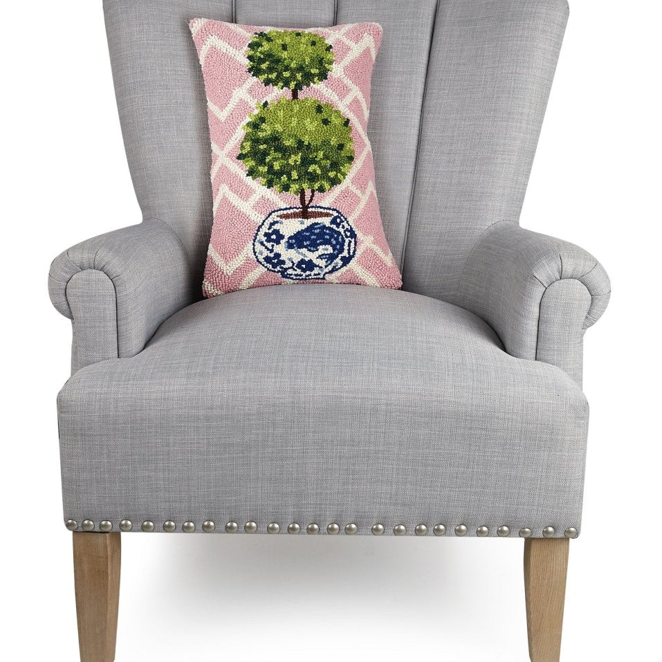Pink Lattice Ball Topiary Hooked Wool Throw Pillow on an armchair, showing the throw pillow at room scale, 12x18 inch