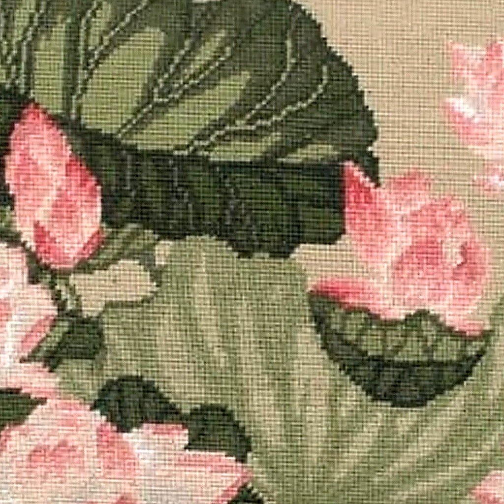 Closeup of Pink Lotus Botanical needlepoint throw pillow highlighting hand-stitched wool craftsmanship and fabric detail