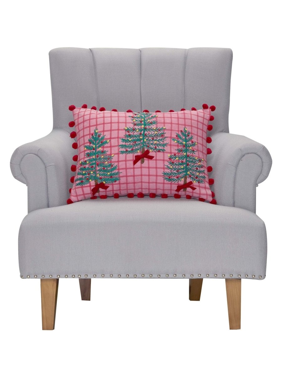 Pink Plaid Trees with Poms Embroidered Christmas Throw Pillow on an armchair, showing the throw pillow at room scale, 14x20 inch