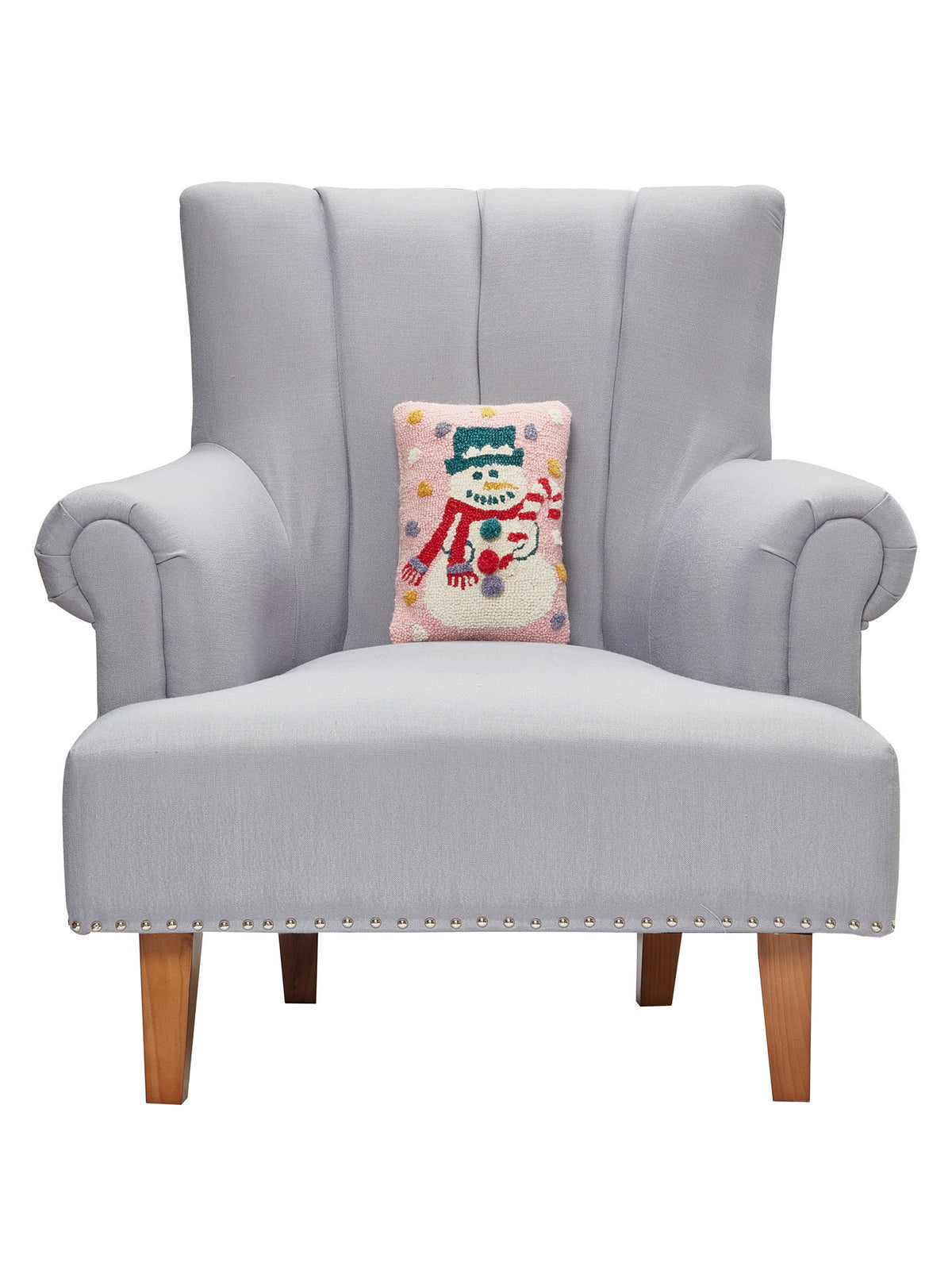 Pink Snowman Hooked Wool Christmas Throw Pillow 8x12 on an armchair, showing the throw pillow at room scale, 8x12 inch