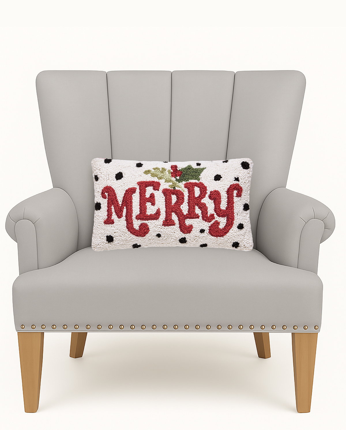 Polka Merry Hooked Wool Christmas Throw Pillow on an armchair, showing the throw pillow at room scale, 9x16 inch