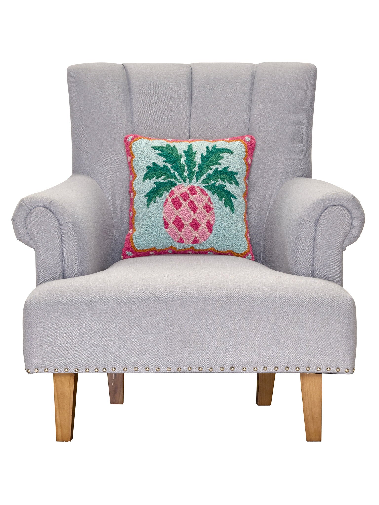 Preppy Pineapple Hooked Wool Throw Pillow on an armchair, showing the throw pillow at room scale, 14x14 inch