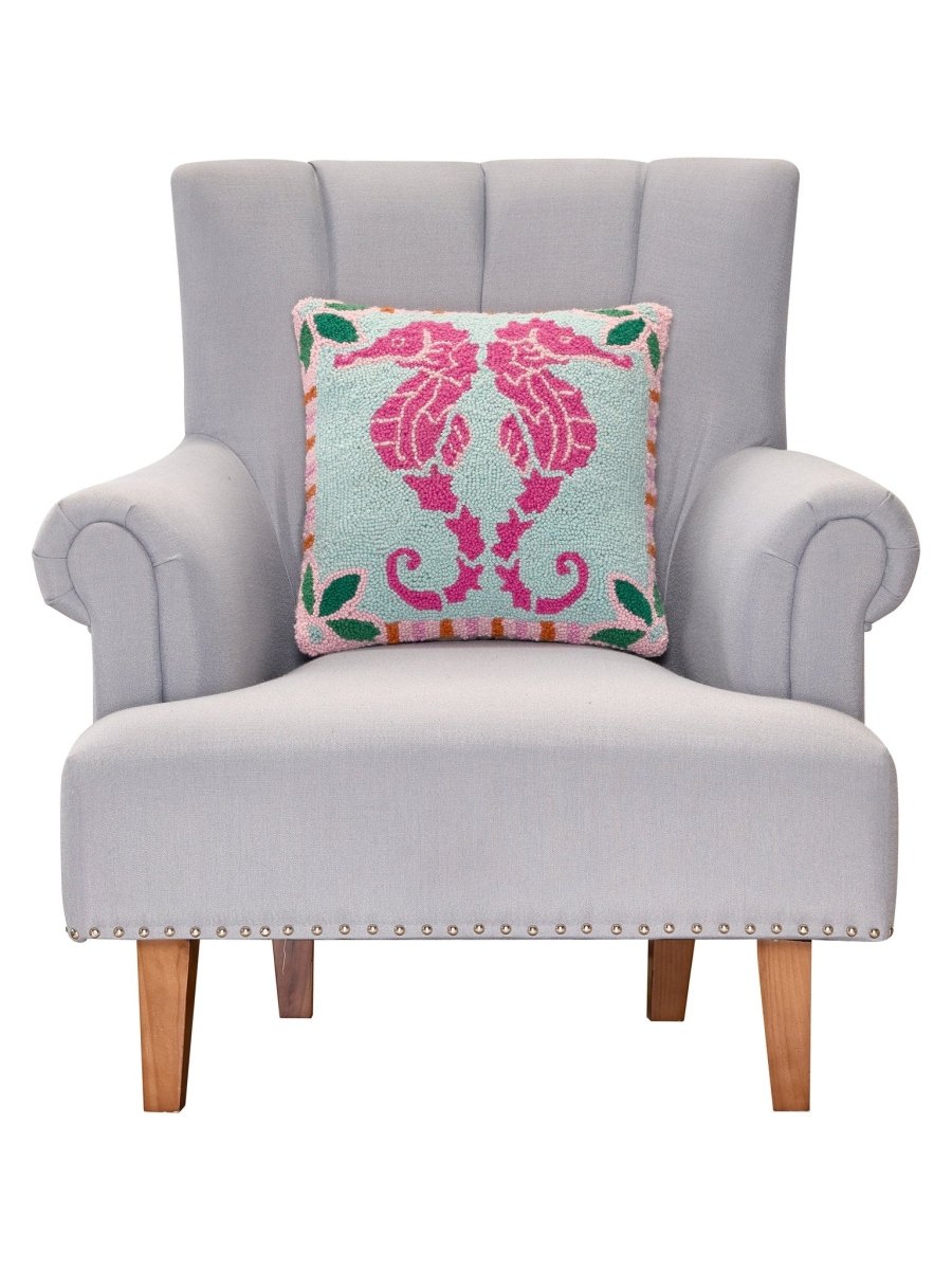 Preppy Seahorse Hooked Wool Throw Pillow on an armchair, showing the throw pillow at room scale, 16x16 inch