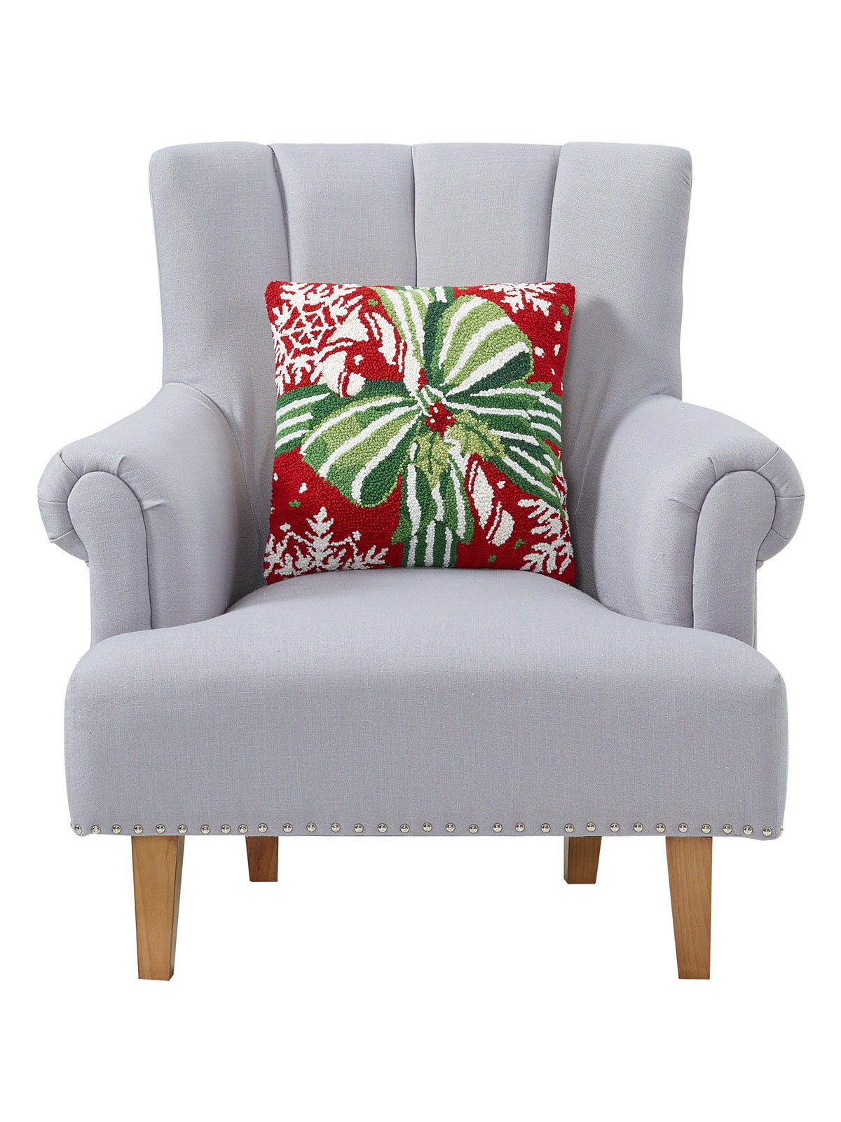 Pretty Present Hooked Wool Christmas Throw Pillow on an armchair, showing the throw pillow at room scale, 16x16 inch