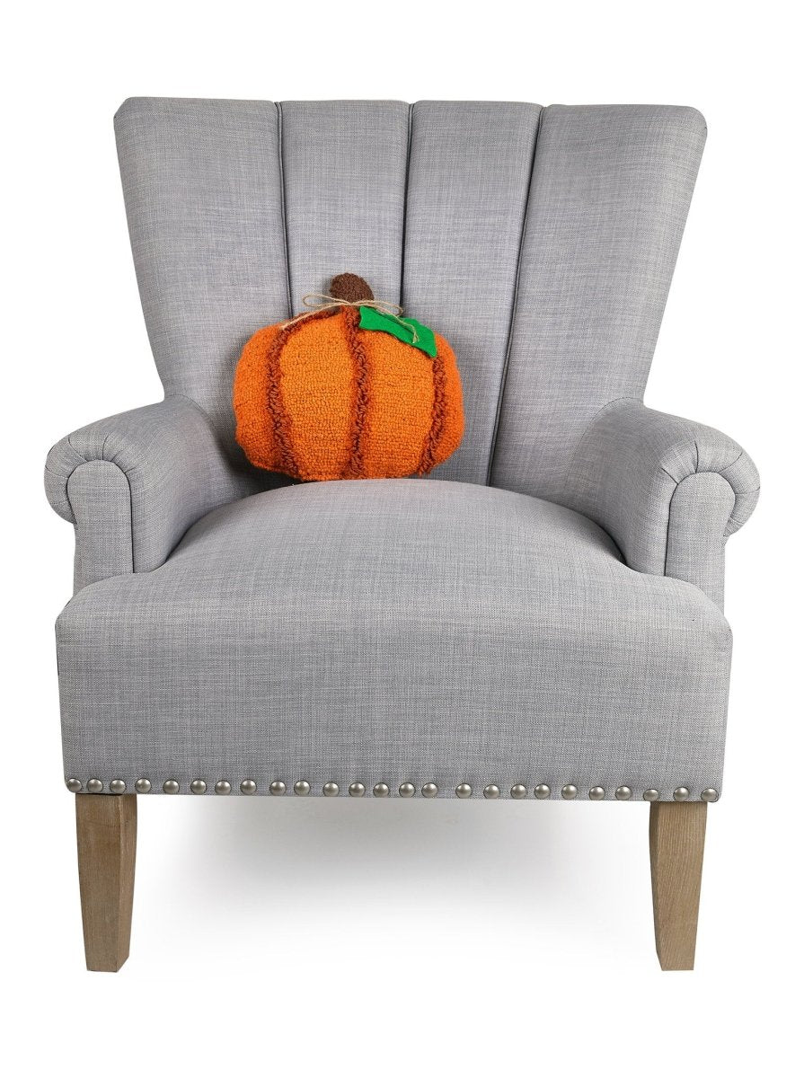 Pumpkin with Leaf Applique Hooked Wool Fall Harvest Throw Pillow on an armchair, showing the throw pillow at room scale, 12x12 inch