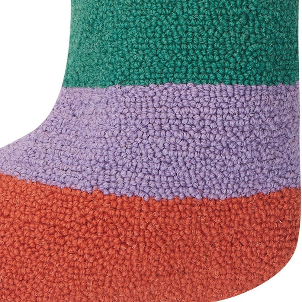 Closeup of Rainbow Stripe with Pom Tassel Hooked Christmas Stocking showing stitch texture and craftsmanship detail