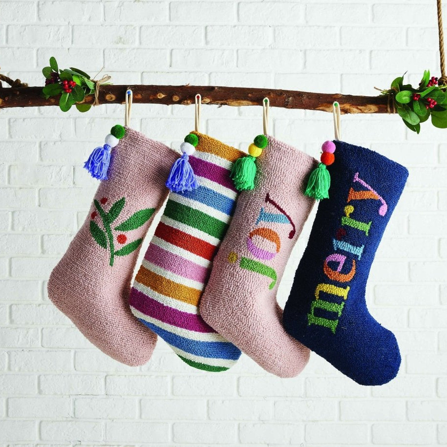 Rainbow with Pom Tassel Hooked Wool Christmas Stocking shown alongside other designs in the same collection, 12x20 inch