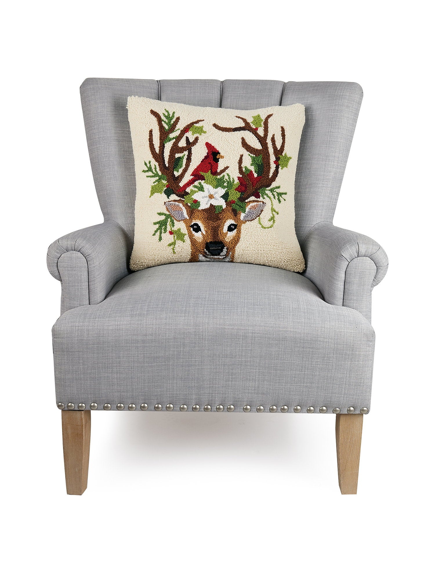 Reindeer and Cardinal Hooked Wool Christmas Throw Pillow on an armchair, showing the throw pillow at room scale, 18x18 inch