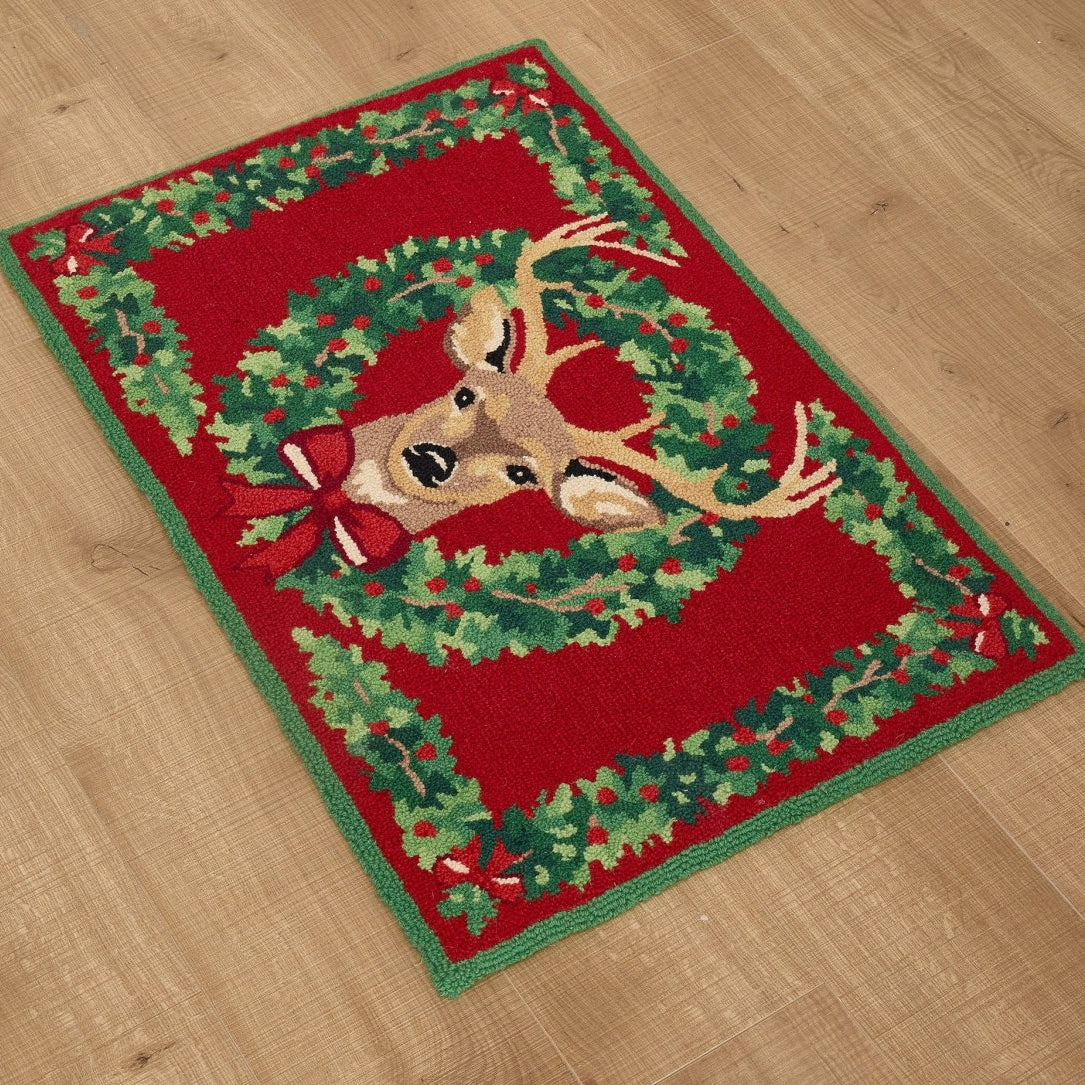 Reindeer Wreath Hooked Wool Christmas Rug styled in a room setting, 2x3 feet