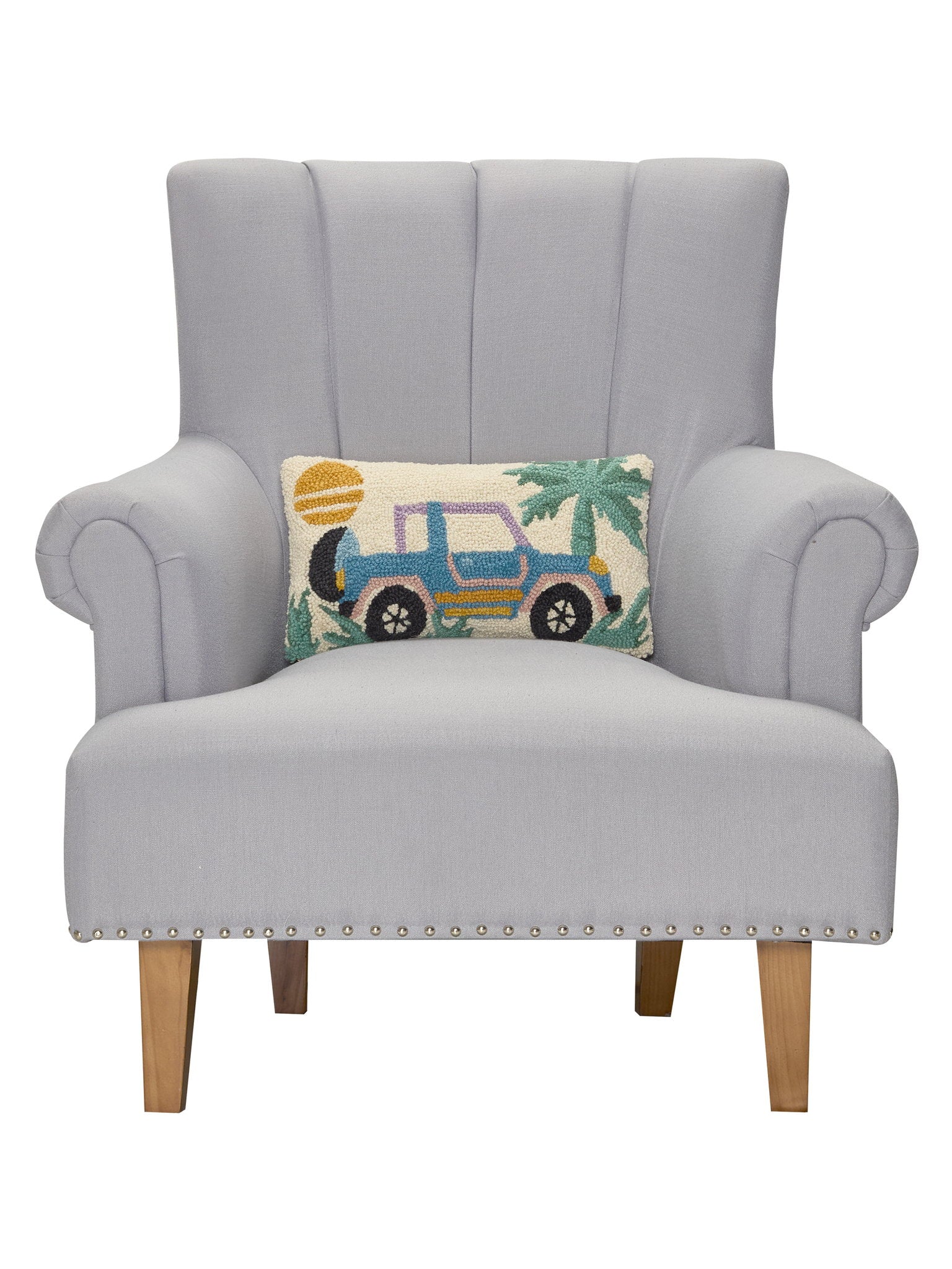Retro Jeep Hooked Wool Throw Pillow on an armchair, showing the throw pillow at room scale, 9x16 inch