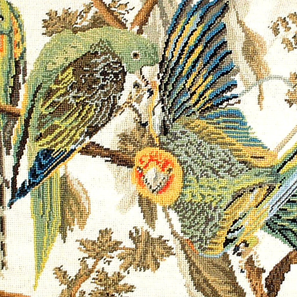 Hand-stitched wool detail of Rustic Carolina Parrot Audubon needlepoint pillow showing intricate weave pattern and texture