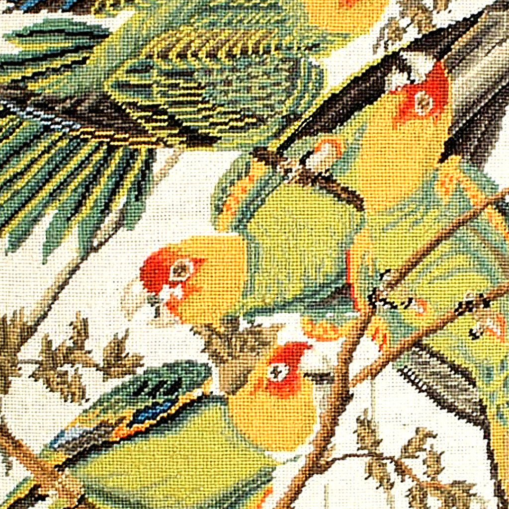 Closeup of Rustic Carolina Parrot Audubon needlepoint throw pillow highlighting hand-stitched wool craftsmanship and fabric detail