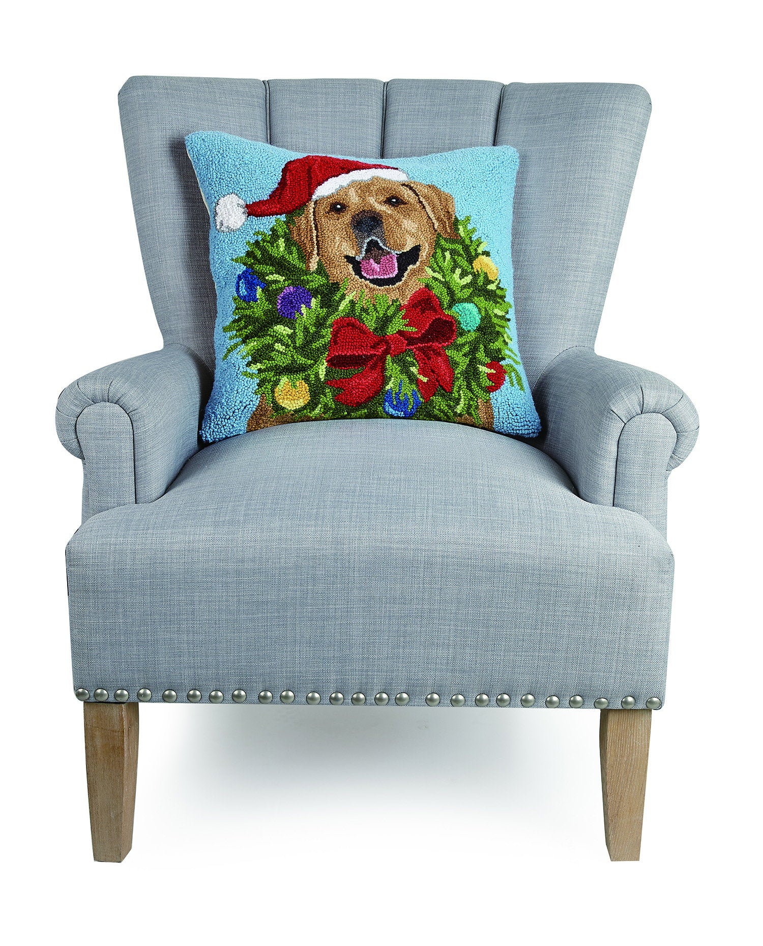 Santa Golden Labr Wreath Hooked Wool Christmas Throw Pillow on an armchair, showing the throw pillow at room scale, 18x18 inch