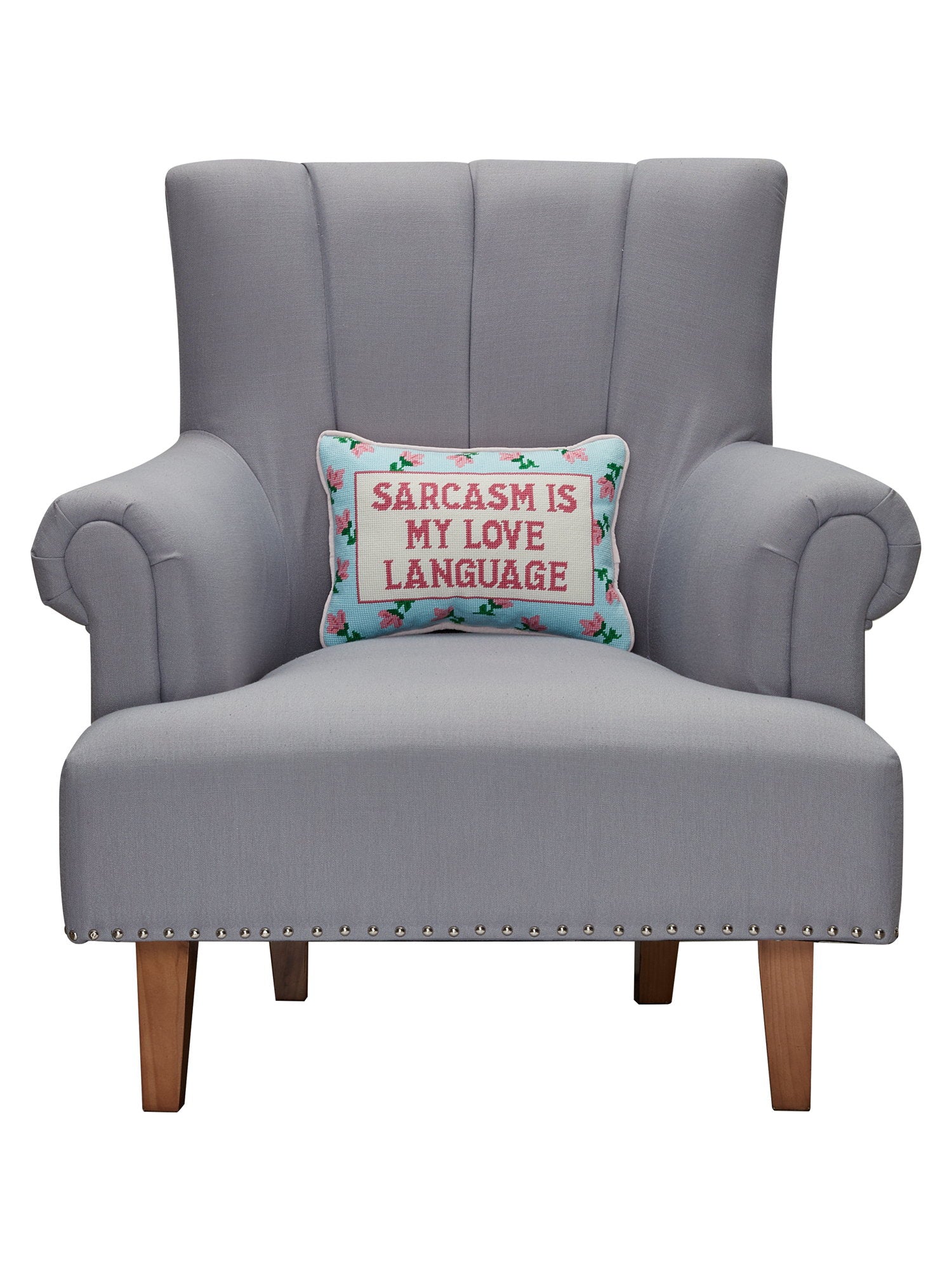 Sarcasm's My Love Embroidered Needlepoint Throw Pillow on an armchair, showing the throw pillow at room scale, 10x14 inch