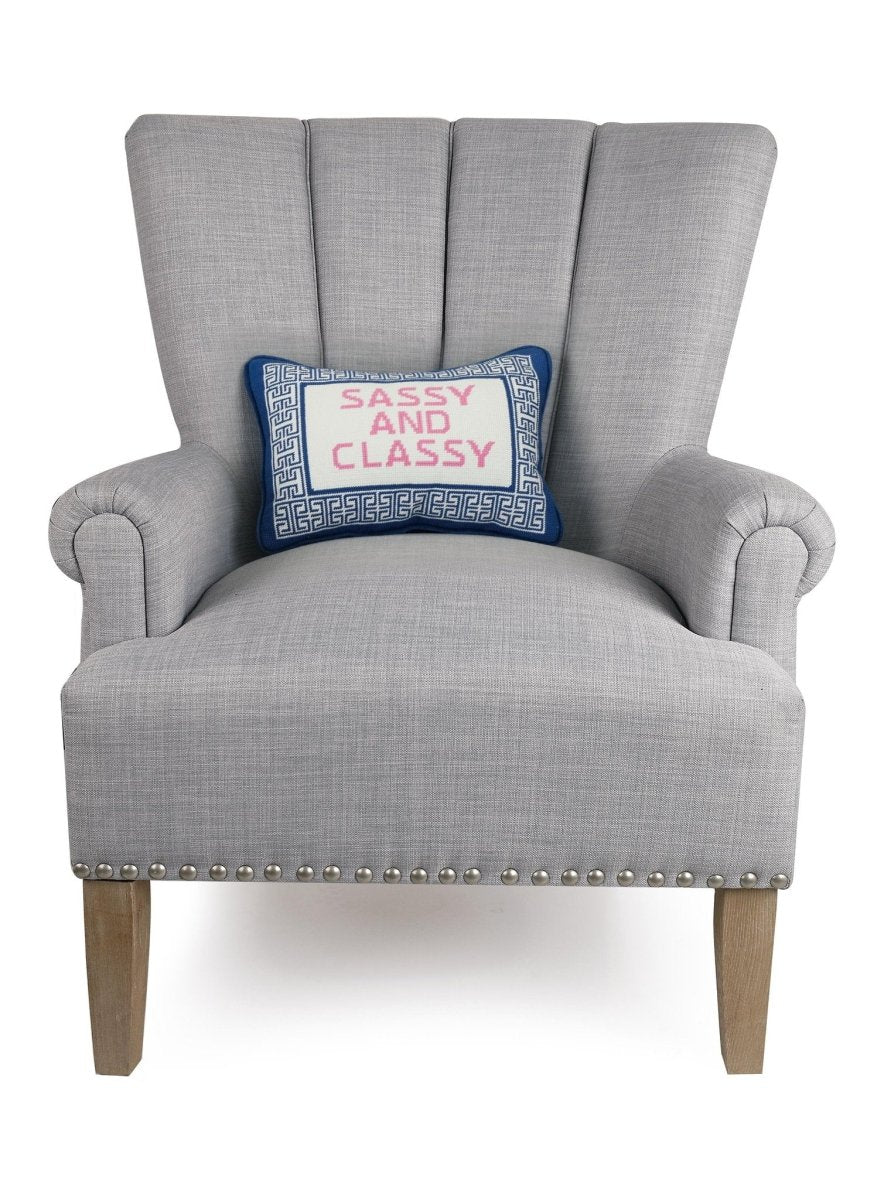 Sassy/Classy Embroidered Needlepoint Throw Pillow on an armchair, showing the throw pillow at room scale, 10x14 inch