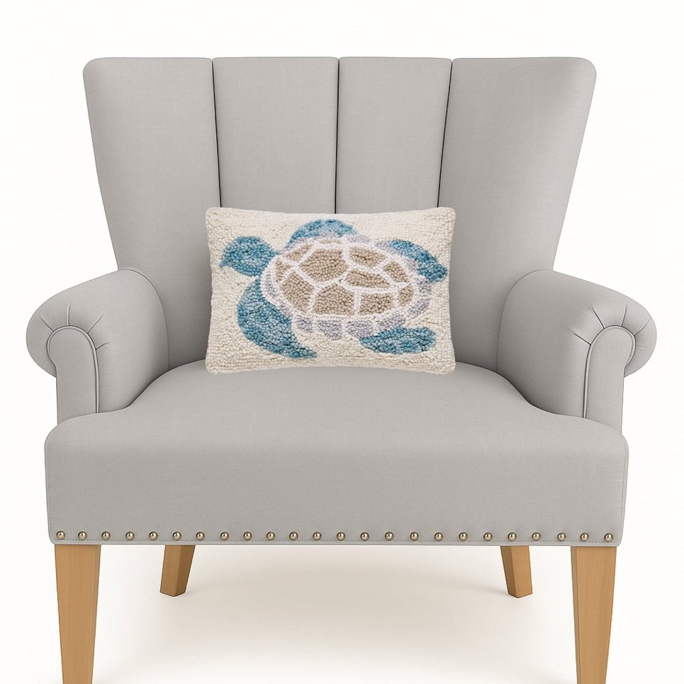 Sea Turtle Hooked Wool Throw Pillow on an armchair, showing the throw pillow at room scale, 8x12 inch