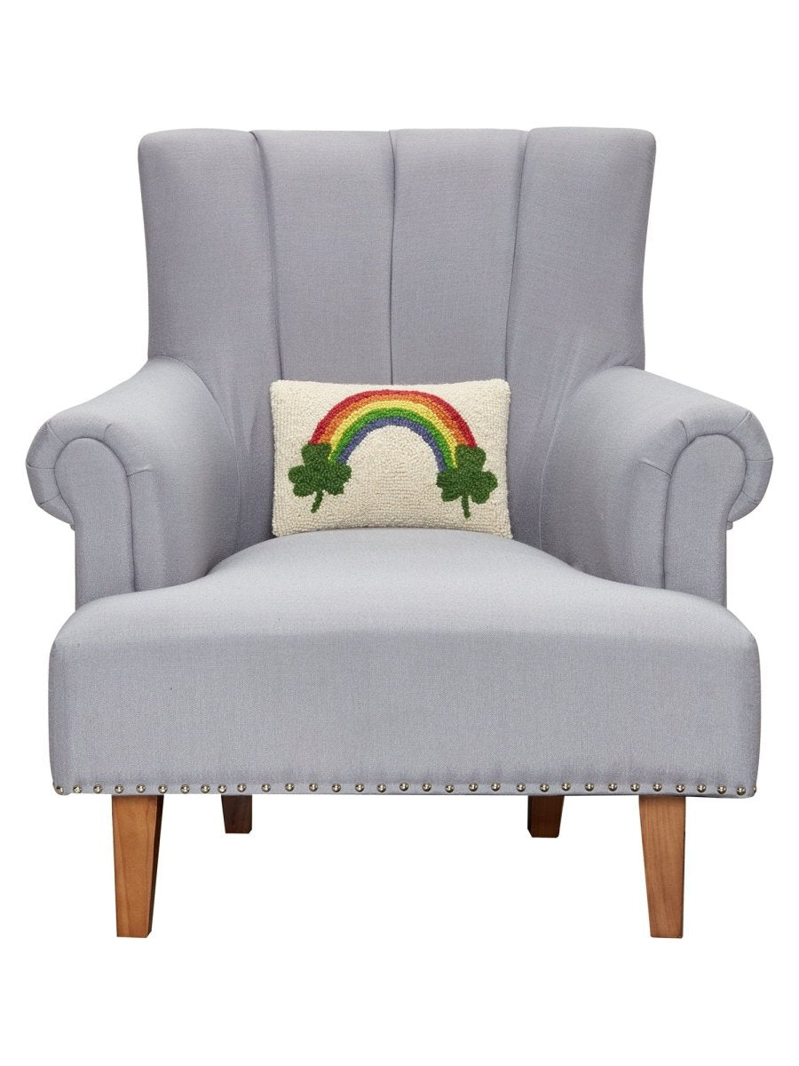 Shamrock Rainbow Hooked Wool St. Patrick's Day Throw Pillow on an armchair, showing the throw pillow at room scale, 8x12 inch