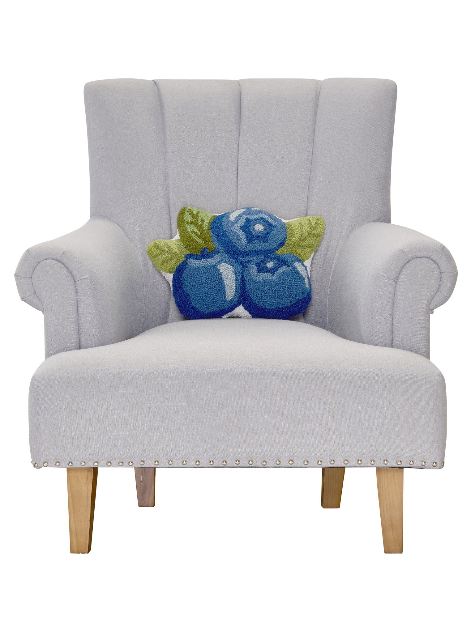Shaped Blueberries Hooked Wool Throw Pillow on an armchair, showing the throw pillow at room scale, 12x16 inch