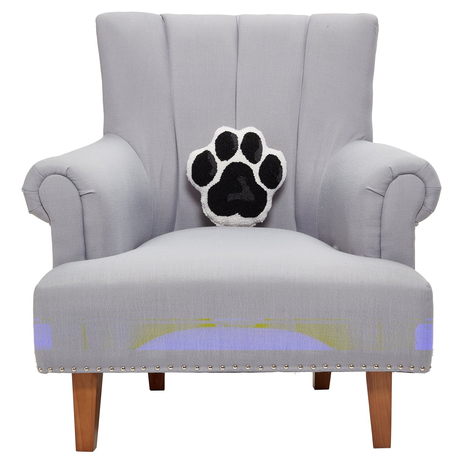 Shaped Dog Paw Hooked Wool Throw Pillow on an armchair, showing the throw pillow at room scale, 10x10 inch